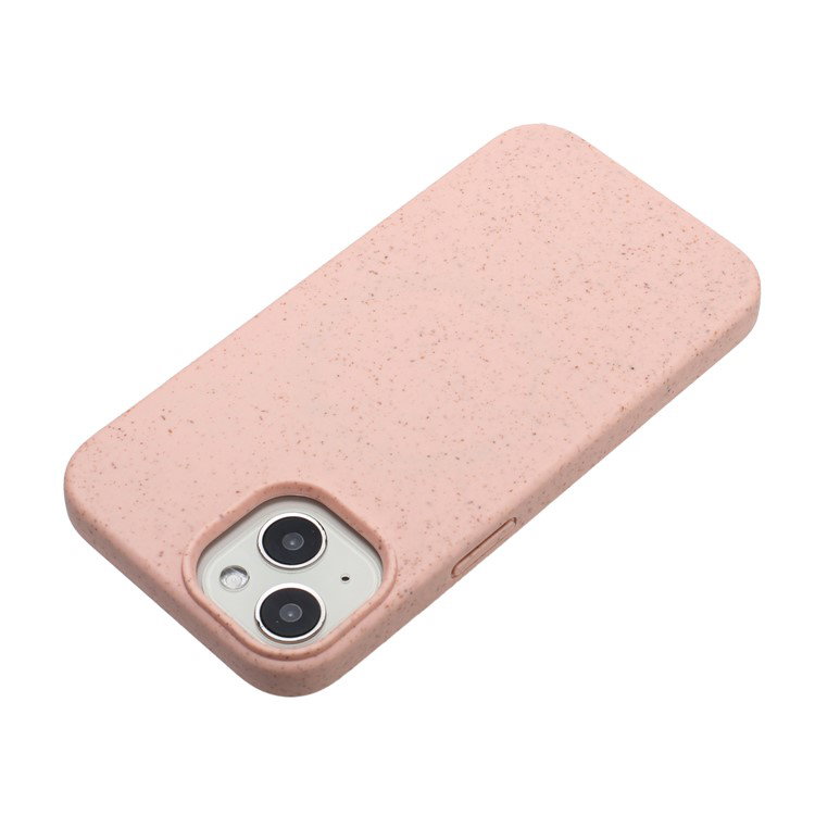 Nærbillede af lyserødt iPhone 14 cover med støvbeskyttede knapåbninger