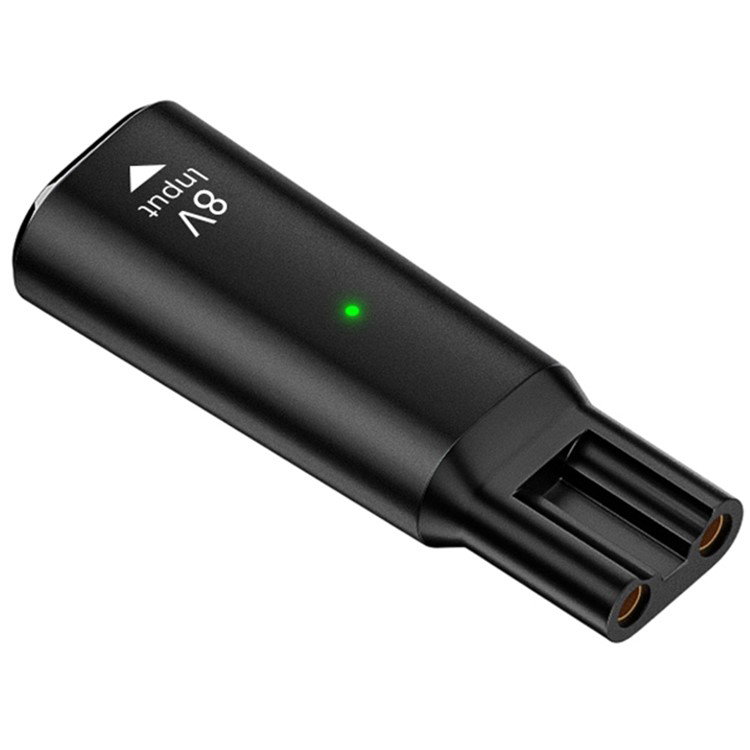 Adapter vist i brug med Philips hårklipper